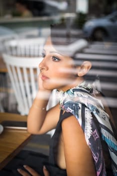 Beautiful woman sitting in cafe