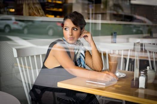 Beautiful middle eastern woman in coffee shop