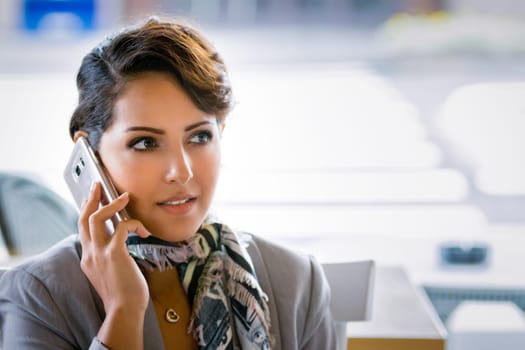 Middle eastern woman talking on phone