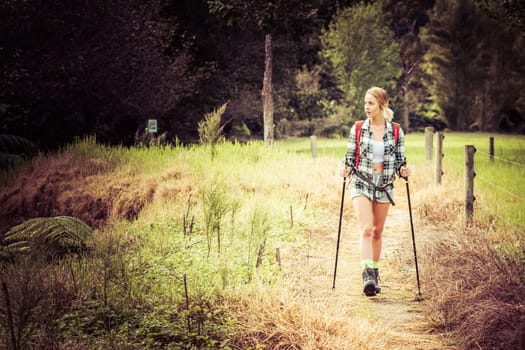 Young woman with hiking poles