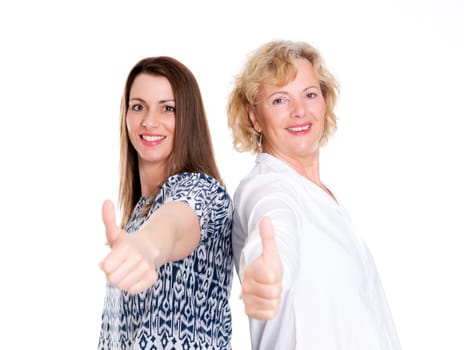 young woman and her mother with thumb up in front of white background
