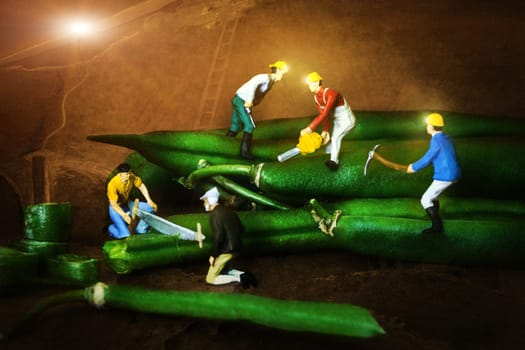 Miniature figurines conceptual, processing the green beans underground operation