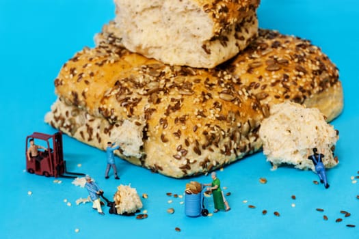 conceptual workers digging and transporting healthy seed buns