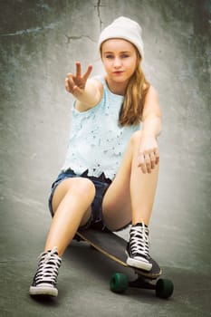 Skater girl showing peace sign