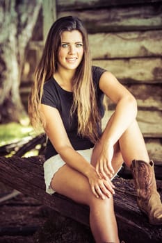 Happy smiling country girl sitting