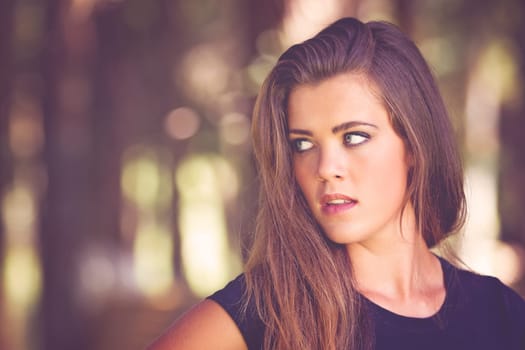 Beautiful young brunette woman with copy space