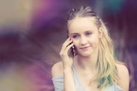 Blond girl talking on cell phone