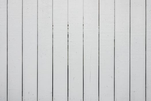 Close up of an old withered white fence that can be used as background or overlay