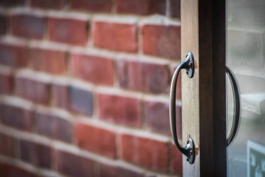 Old weathered wooden home doors handle detail
