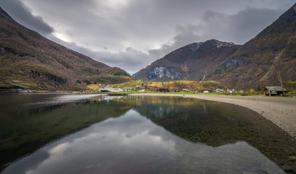Stunning scenery of norwegian fiord as seen from the shore in small village Flam, Norway