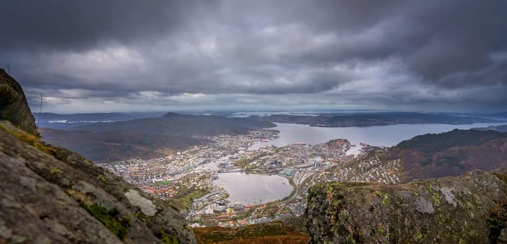 Panoramic view of Bergen town on a cloudy day as seen from the top of Mount Ulriken, Norway