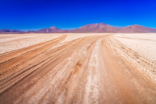 Gravel and corrugated desert road through remote part of southern Altiplano, Bolivia