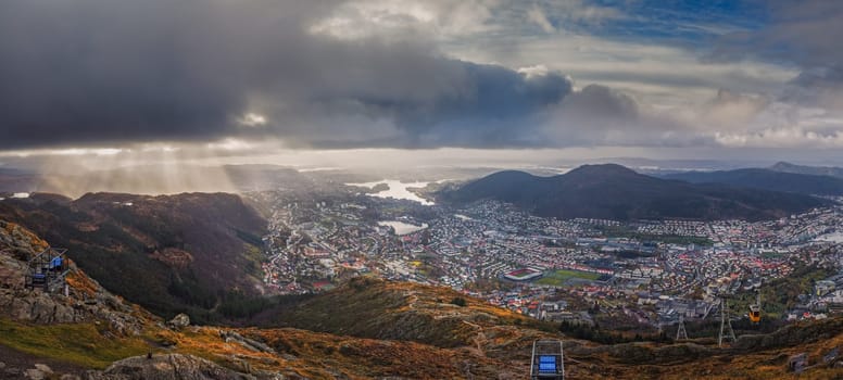 Panoramic view of Bergen town on a cloudy day as seen from the top of Mount Ulriken, Norway
