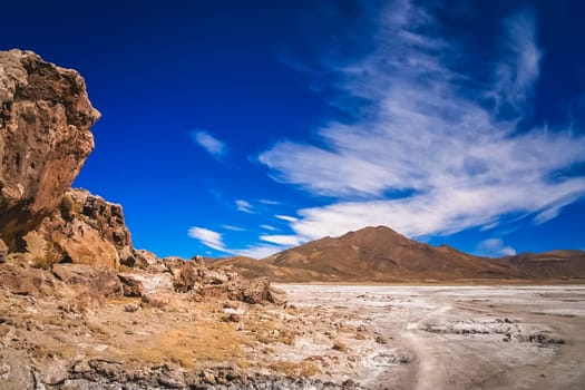 Dry land plain in the Altiplano mountains near Salar de Uyuni in summer, Andes, Bolivia