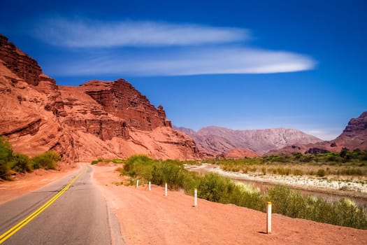 Road through colourful polychromic mountains in Northern Argentina