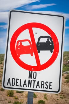 Sign forbidding overtaking on the winding mountain road in Argentina