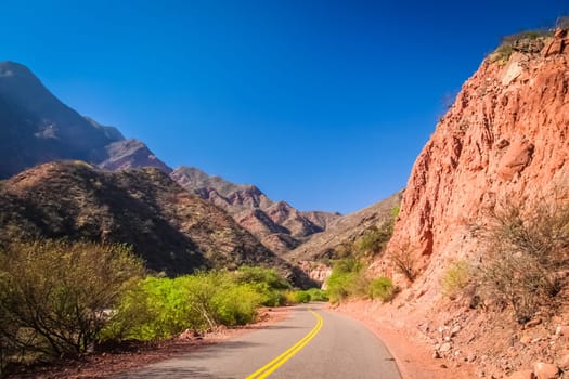 Road through colourful polychromic mountains in Northern Argentina