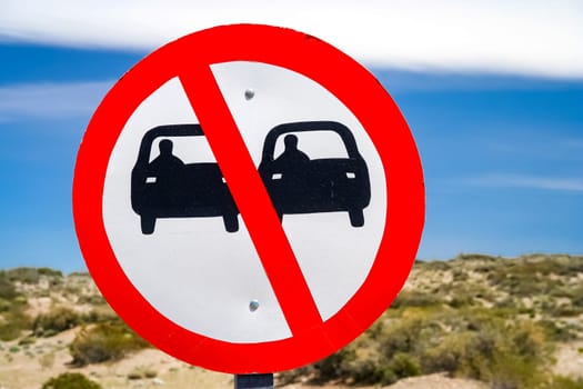 Sign forbidding overtaking on the winding mountain road in Argentina
