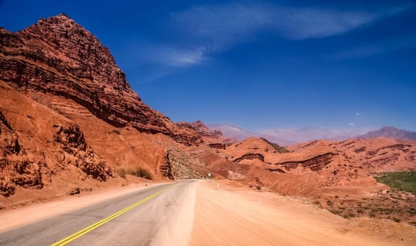 Road through colourful polychromic mountains in Northern Argentina