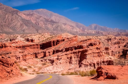 Road through colourful polychromic mountains in Northern Argentina