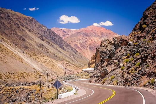 Winding road through stunning mountain scenery from Mendoza in Argentina to Chile over the Andes range