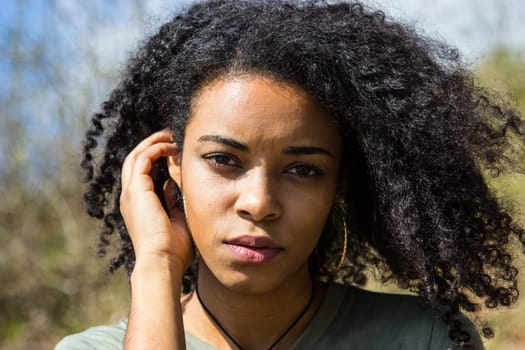 Portrait of an attractive African-American woman. Outdoor Shooting.