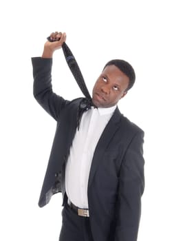A young African American business man try to make suicide with.his necktie, isolated for white background.