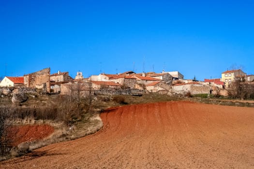 Small Spanish village and a field in an early spring
