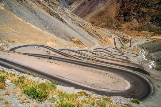 Twisting and turning switchback road through high Andes in Chile, South America