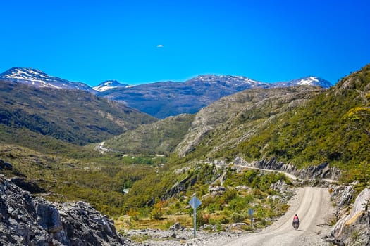 Cyclist climbing up the hill on the Carretera Austral, southern Patagonia, Chile