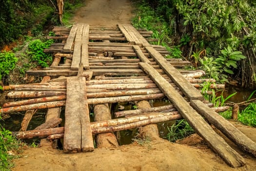 Small wooden bridge on the rural road to Maroantsetra