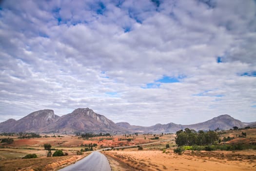Road going through the stunning landscape of Madagascar highlands, central Madagscar