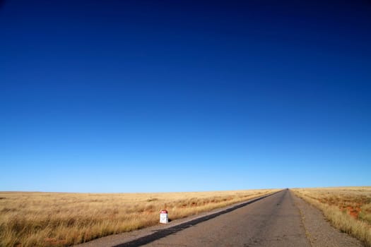 Road through empty grassland in central Madagascar