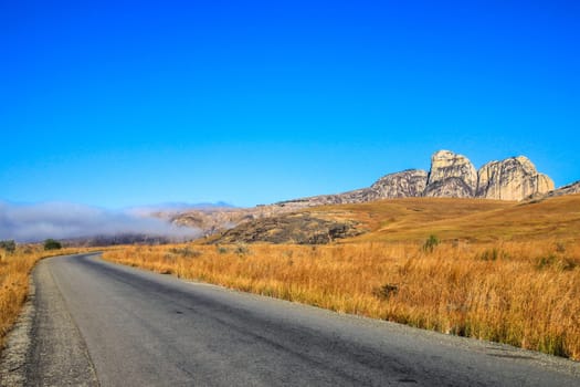 Road going through the stunning landscape of Madagascar highlands, central Madagscar
