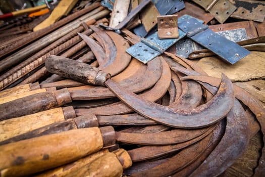 Old rusted scythes for sale on the market in Madagascar