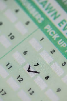 Ticked lucky number 7 on the lottery slip