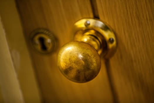 Golden door knob on wooden doors