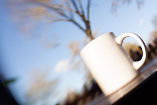 Coffee mug on an outside table in a cafe