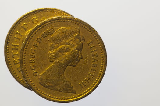 Two one pound coins on the white background