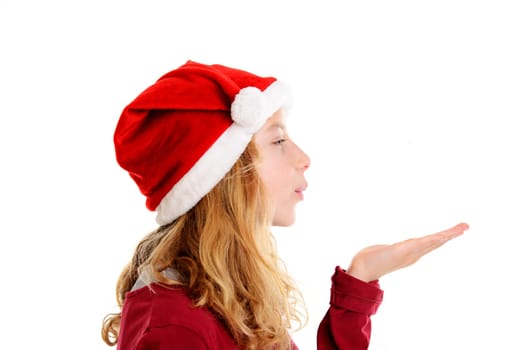 blond girl with Santa- Claus cap blowing over the hand