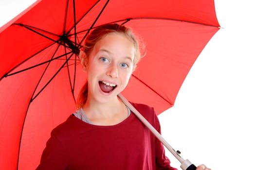 laughing blond girl with red umbrella in frontof white background