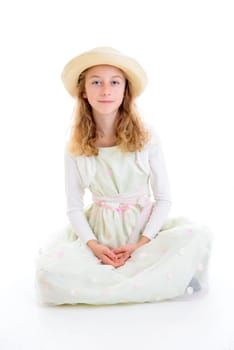 nice girl with blond hair in white dress and straw hat