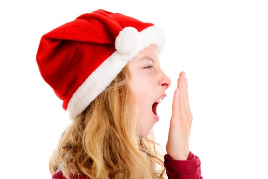 blond girl with Santa- Claus cap is yawning