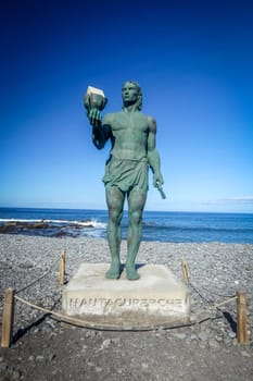 Statue of Hautacuperche, Guanche King, in La Puntilla, Valle Gran Rey, La Gomera Island, Canary Islands, Spain. Hautacuperche was a guanche warrior who led an uprising against the Spanish in 1488