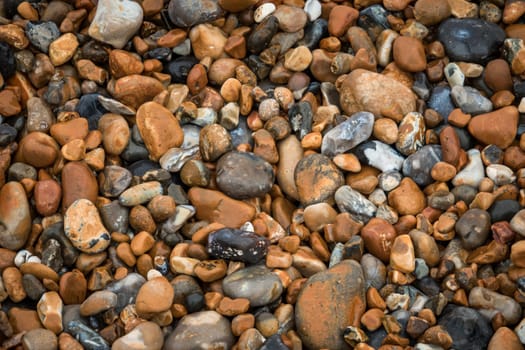 Picture of a pile of peebles on the ground on the beach