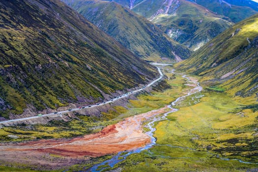 Dusty mountain road from Eastern Tibet to Yunnan province in China