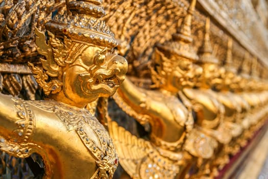 Golden sculptures decorating Grand Palace and Wat Phra Kaeo in Bangkok, Thailand
