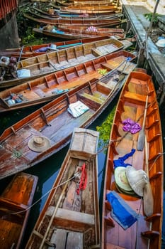 Empty boats in the dock on floating market in Damnoen Saduak Thailand
