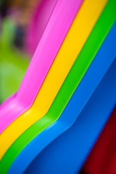 Background of the colorful sides of plastic sleds