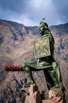 Statue of Incan warrior in the small town of Ollantaytambo in Peru